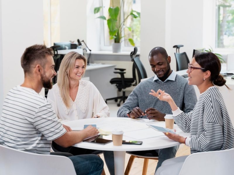 close-up-young-colleagues-having-meeting_23-2149060259
