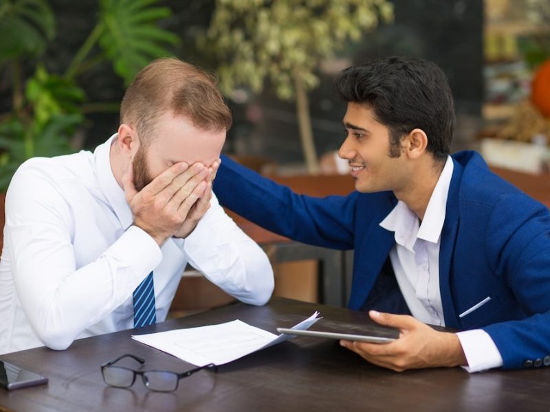 indian-businessman-supporting-colleague-stroking-his-back_1262-17063 indian-businessman-supporting-colleague-stroking-his-back_1262-17063